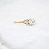 morning-light-bloom-petal-round-moissanite-engagement-ring-0-9-ct-yellow-gold-gemfora-2